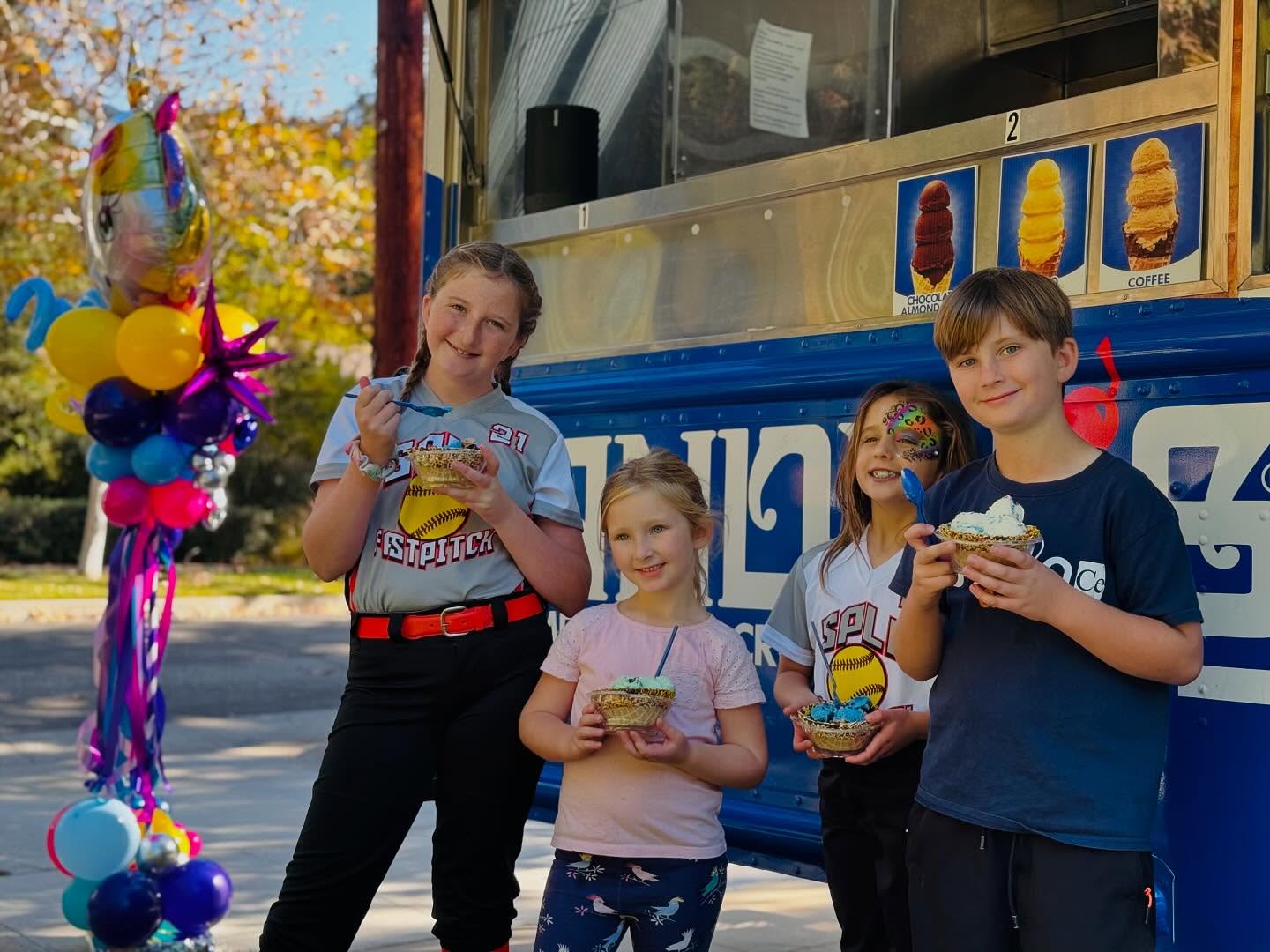 Kids enjoying Handel's ice cream in front of the truck